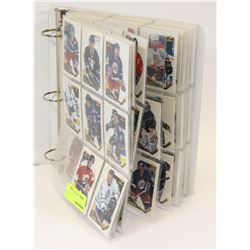 BINDER OF ASSORTED COLLECTOR HOCKEY CARDS.