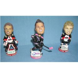 Group of three mini bobble head figures