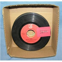 Box of vintage 45 RPM records