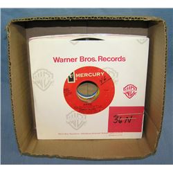 Box of vintage 45 RPM records