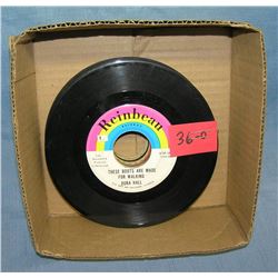 Box of vintage 45 RPM records