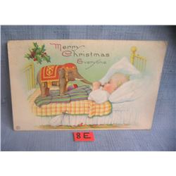 Christmas post card features a child with a Dumbo toy