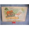 Image 1 : Christmas post card features a child with a Dumbo toy