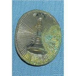 Early raised fire trumpet badge
