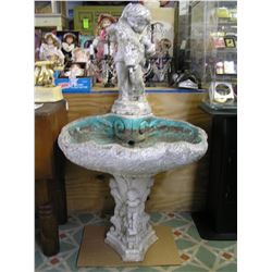 Antique seashell shaped bird bath