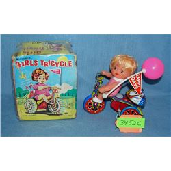 All tin windup Girl on Tricycle toy