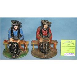 Cast iron figural book ends/paper weights