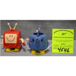 Pair of vintage wind up mechanical walking toys