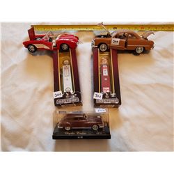 LOT OF 2 1:18 GAS PUMPS AND 3 DIE CAST CARS