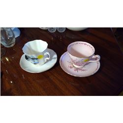 2 bone china tea and saucers
