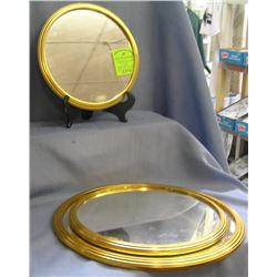 Group of three gold framed vanity framed mirrors