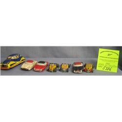 Group of seven vintage all tin vehicles