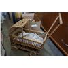 Image 3 : BOX OF BRASS VASE, SCONCE, METAL AND WOOD DECOR, AND DOLL CARRIAGE
