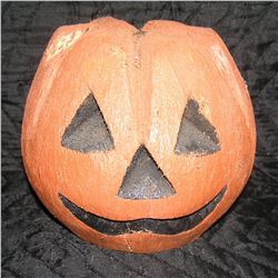 Vintage Jack O Lantern carved from an old coconut