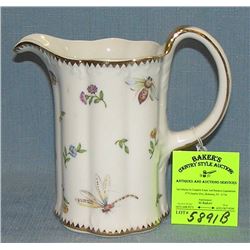 Vintage insect and flower decorated water pitcher