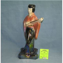 Oriental female stringed instrument playing figure