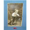 Image 1 : Early photo post card featuring a young boy with toys