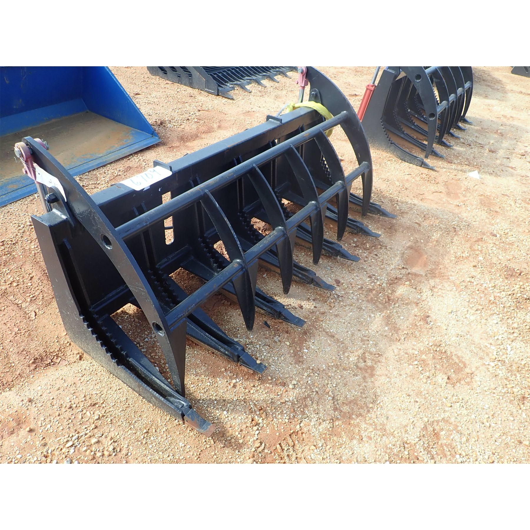 Skid Steer Attachment J.M. Wood Auction Company, Inc.