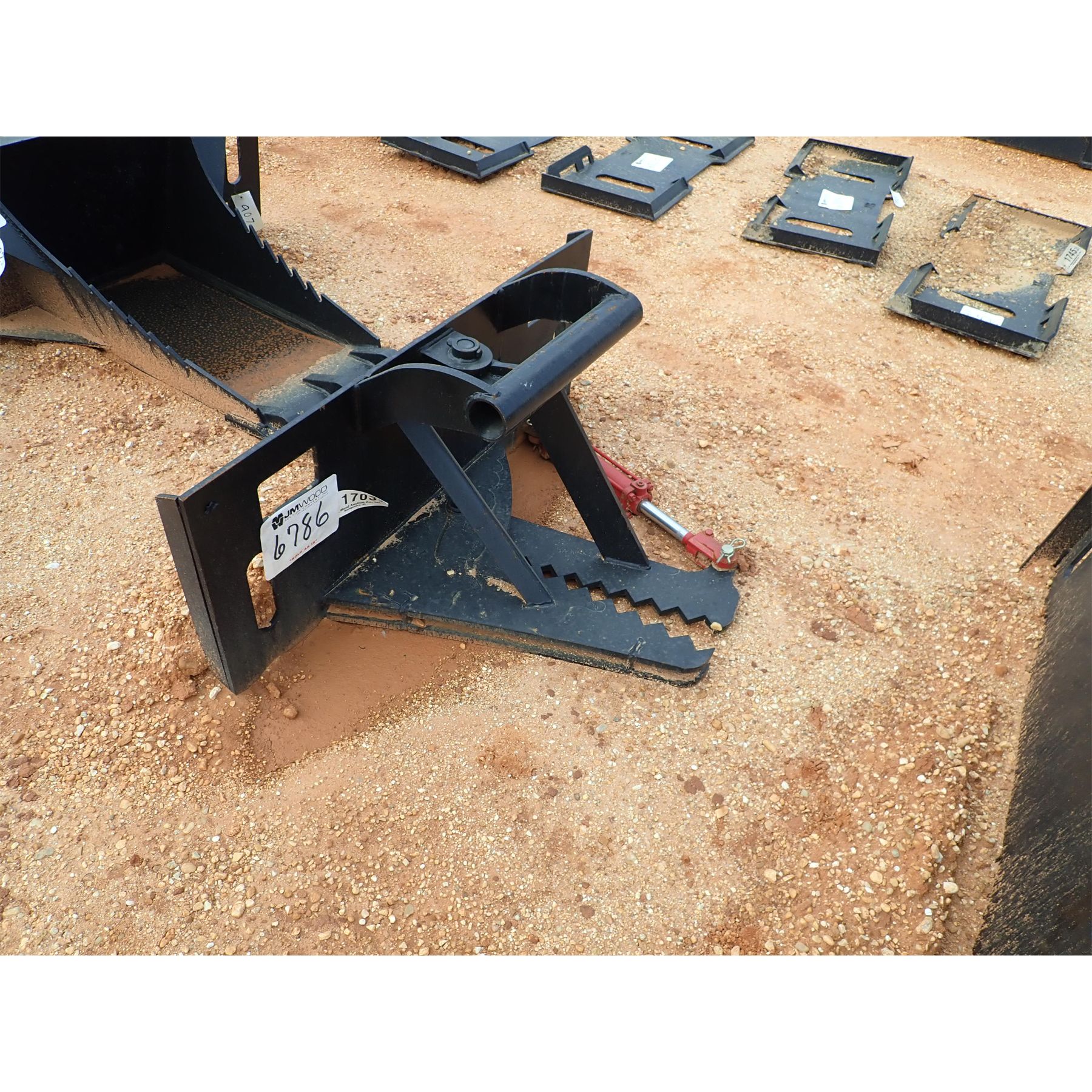 Skid Steer Attachment J.M. Wood Auction Company, Inc.