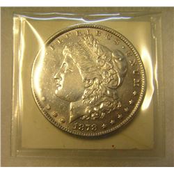 1878S Morgan silver dollar in AU condition