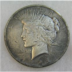 1923 Peace silver dollar in poor condition
