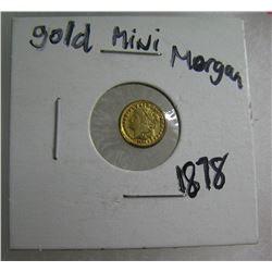 Mini Morgan gold coin dated 1878