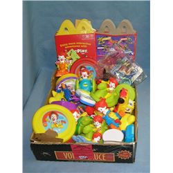 Box full of vintage fast food collectible toys