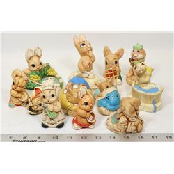 A DOZEN BUNNY FIGURINES