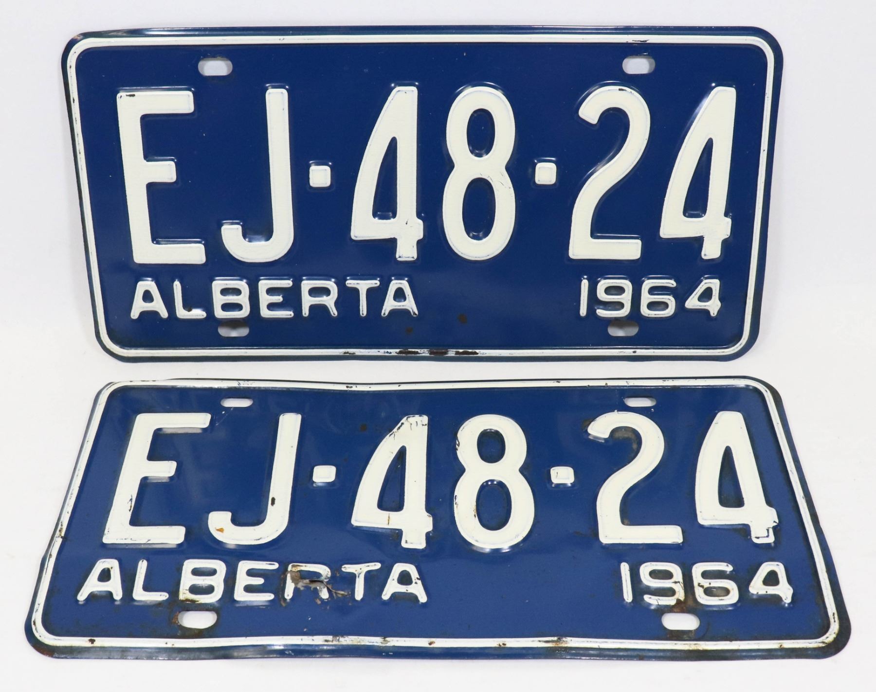 PAIR OF 2 1964 ALBERTA LICENSE PLATES. Kastner Auctions