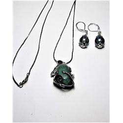 11)  SILVER TONE SETTING WITH GREEN