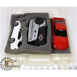 CASE WITH 2 STREET CARS AND REMOTE CONTROL.