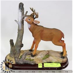 NEW DEER STANDING BY TREE STATUE
