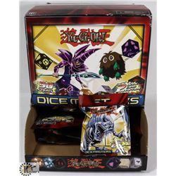 BOX OF YU-GI-OH DICE MASTERS BOOSTER PACKS.
