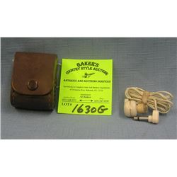 Pair of vintage ear plugs in original leather case