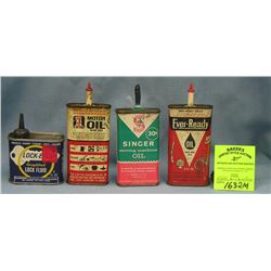 Group of four vintage oil tins including Singer