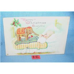 Christmas post card features a child with a Dumbo toy