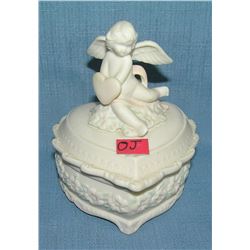 Porcelain heart shaped musical trinket box with Cherub