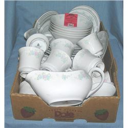 Box of floral decorated dinnerware by China Garden