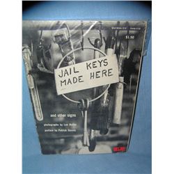 Jail Keys Made Here and other advertising signs