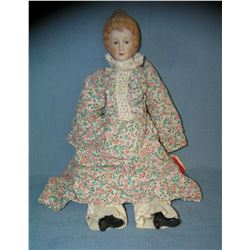 Porcelain and cloth dressed doll 14 inches
