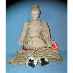 Porcelain and cloth dressed doll 14 inches