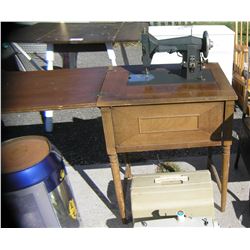 Early Kenmore sewing machine in original cabinet