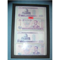 Iraqui currency featuring Saddam Hussien