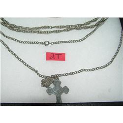 Pair of silver tone necklaces one with religious charms