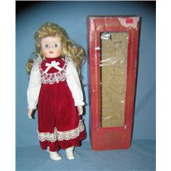 Red and white felt dressed collectible porcelain doll