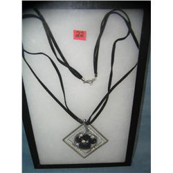 Costume jewelry necklace with an unusual pendant