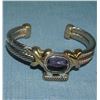 Image 1 : Quality silver tone bracelet with large purple stone