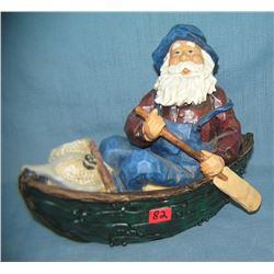 Hand painted fisherman in rowboat figurine