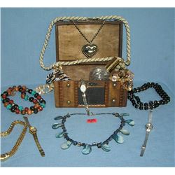 Box full of vintage costume jewelry