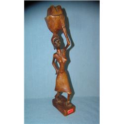 Hand carved African woman carrying a basket